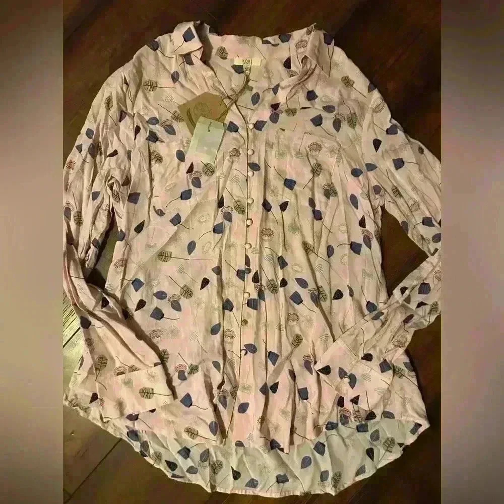 Women’s light pink button up blouse